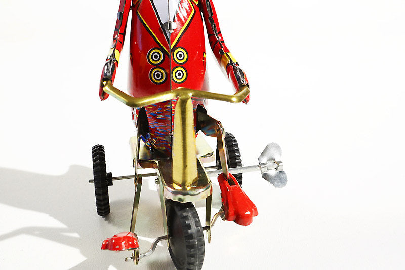 Tin toy duck in tricycle-winding