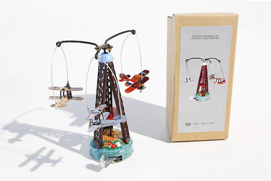 Tin toy Carousel with biplanes