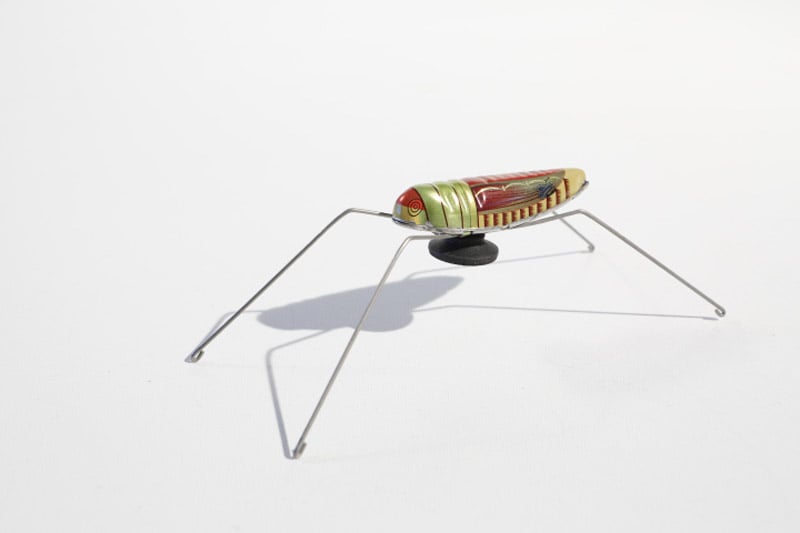 Tin toy Grashopper with bouncing mechanism