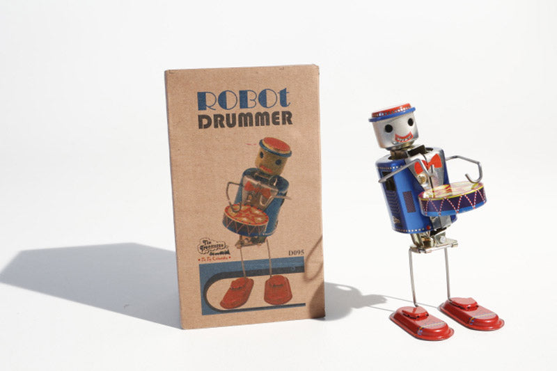 Tin toy robot plays drums-tuned