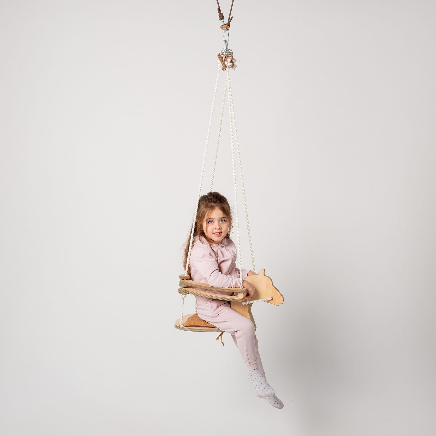 Wooden swing horse with rope