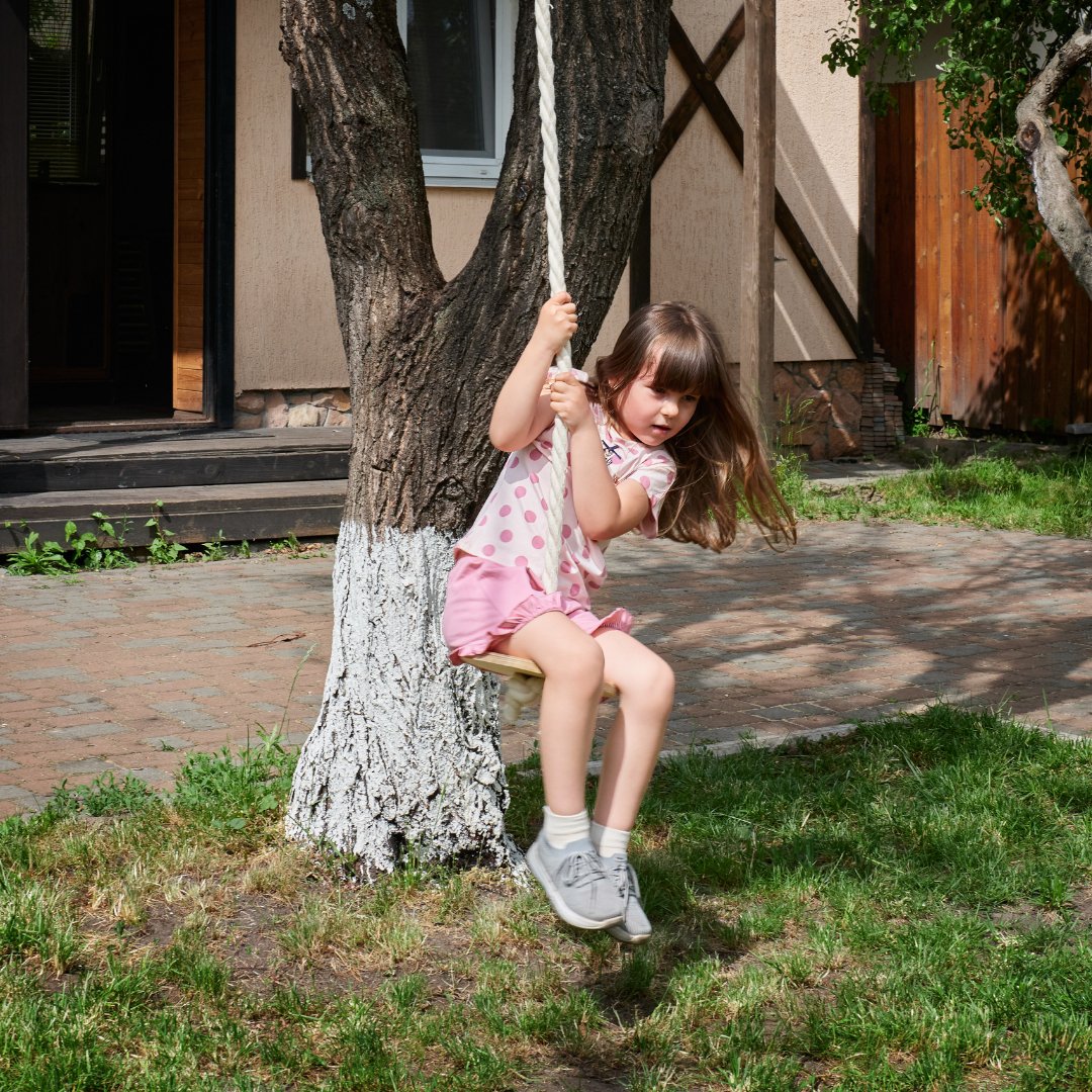 Wooden swing with rope for children